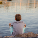 sad-boy-by-water2160