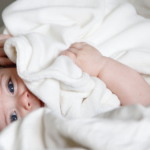 Young baby with blanket