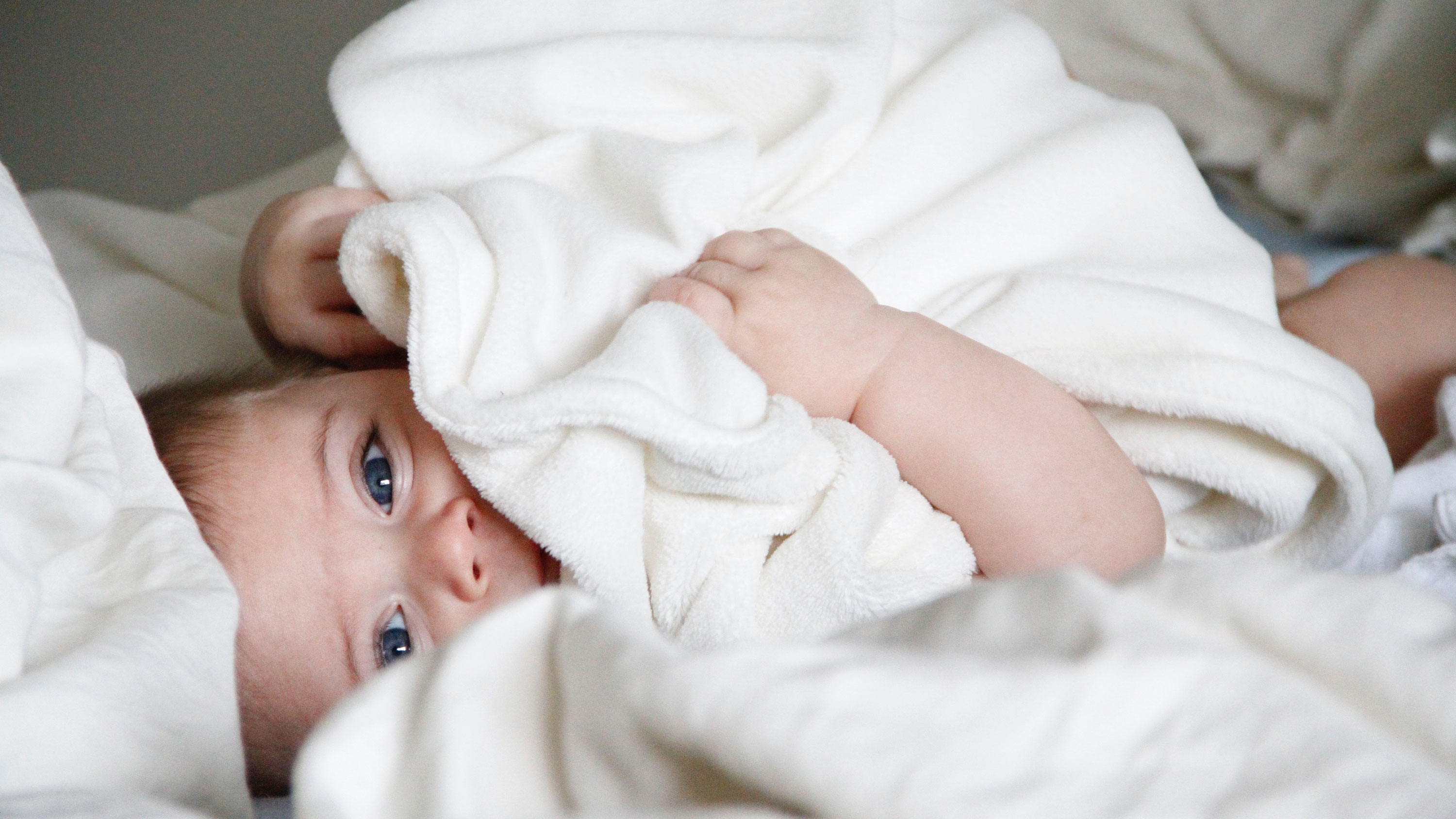 Young baby with blanket