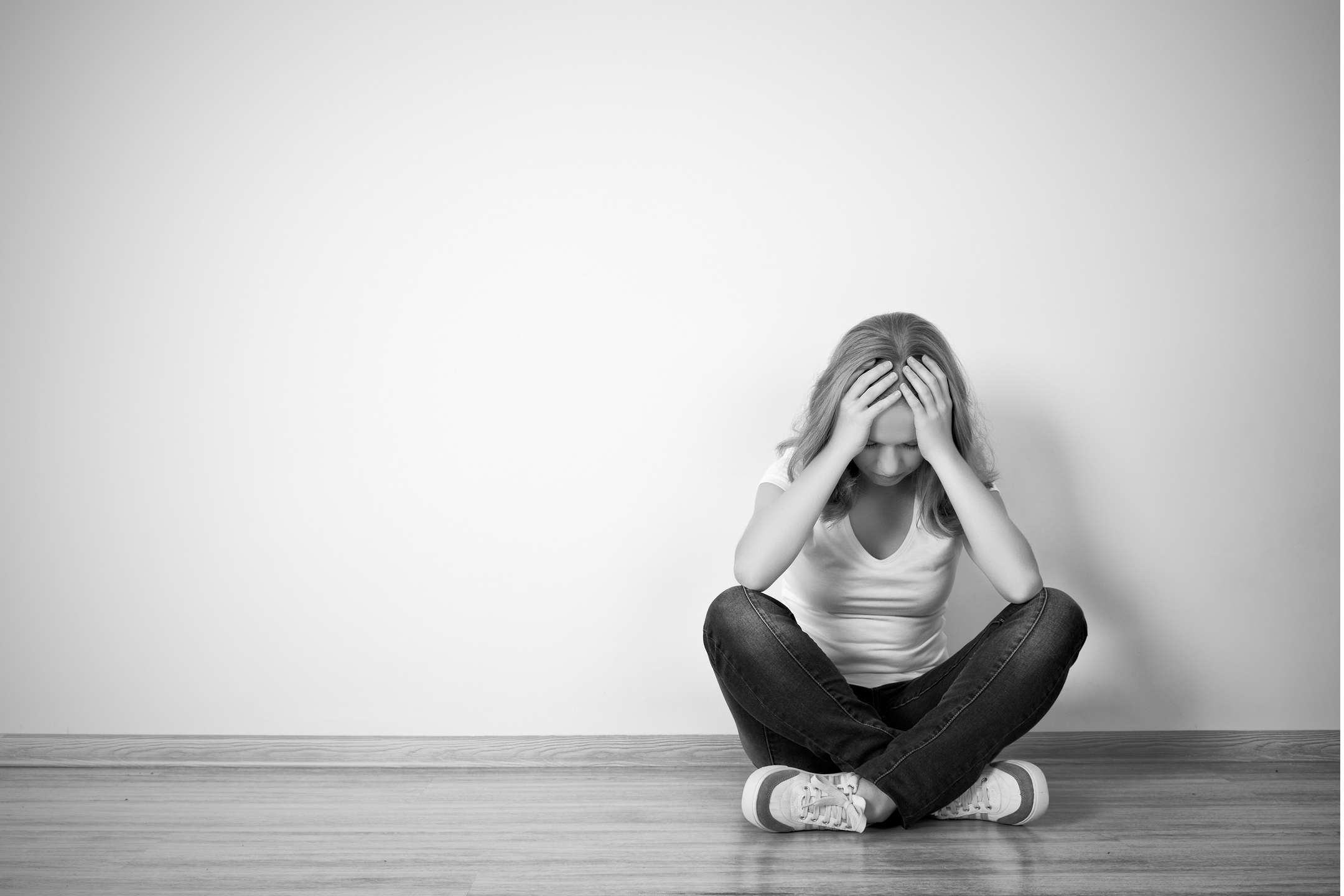 teen-girl-depressed-sitting-mono2160