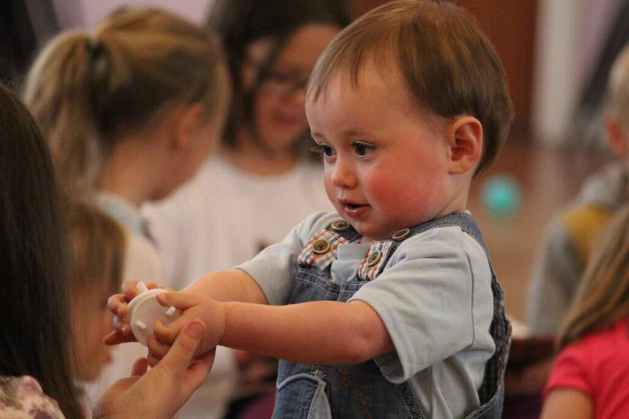 toddler-giving-toy2160