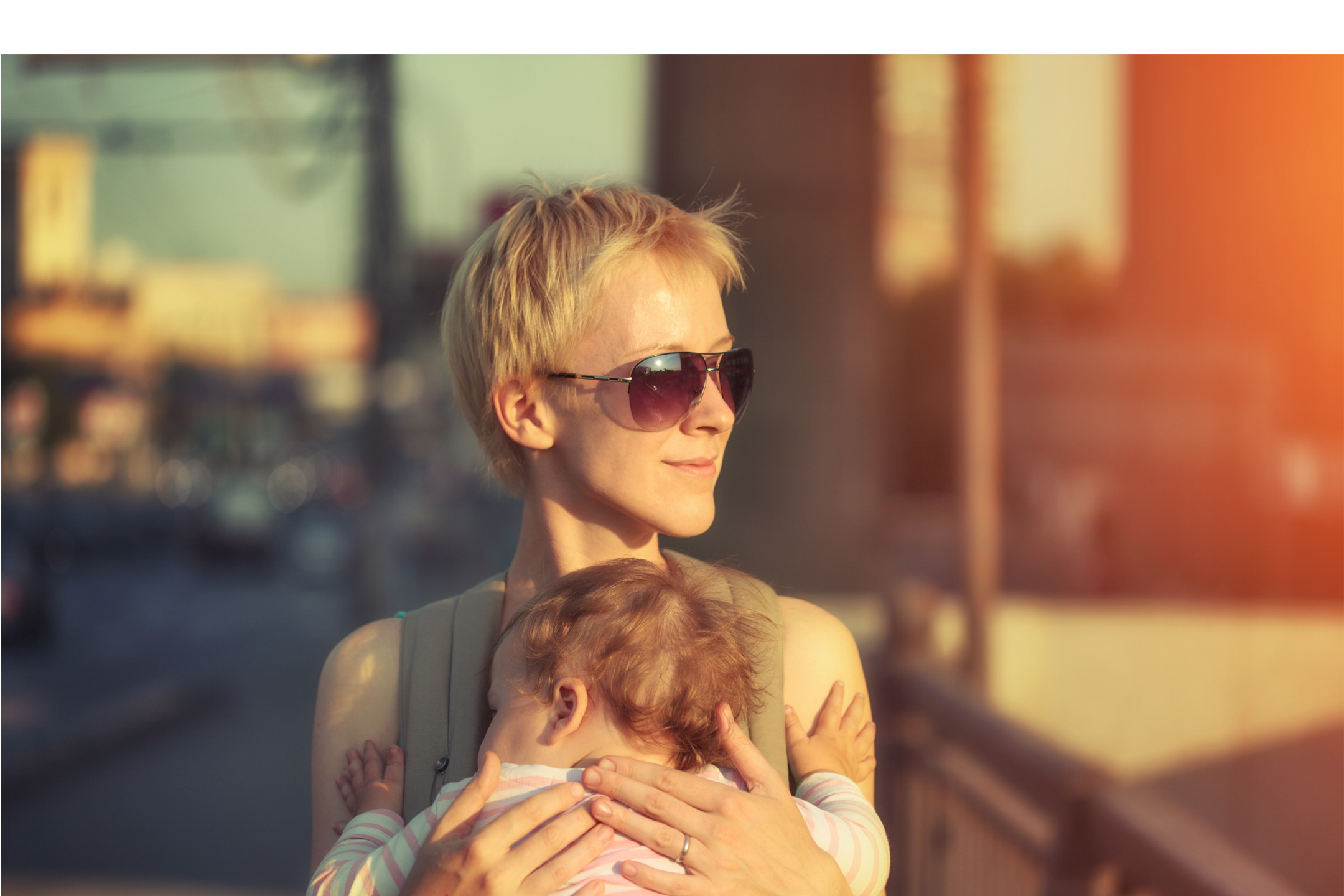 happy-mother-carrying-child2160