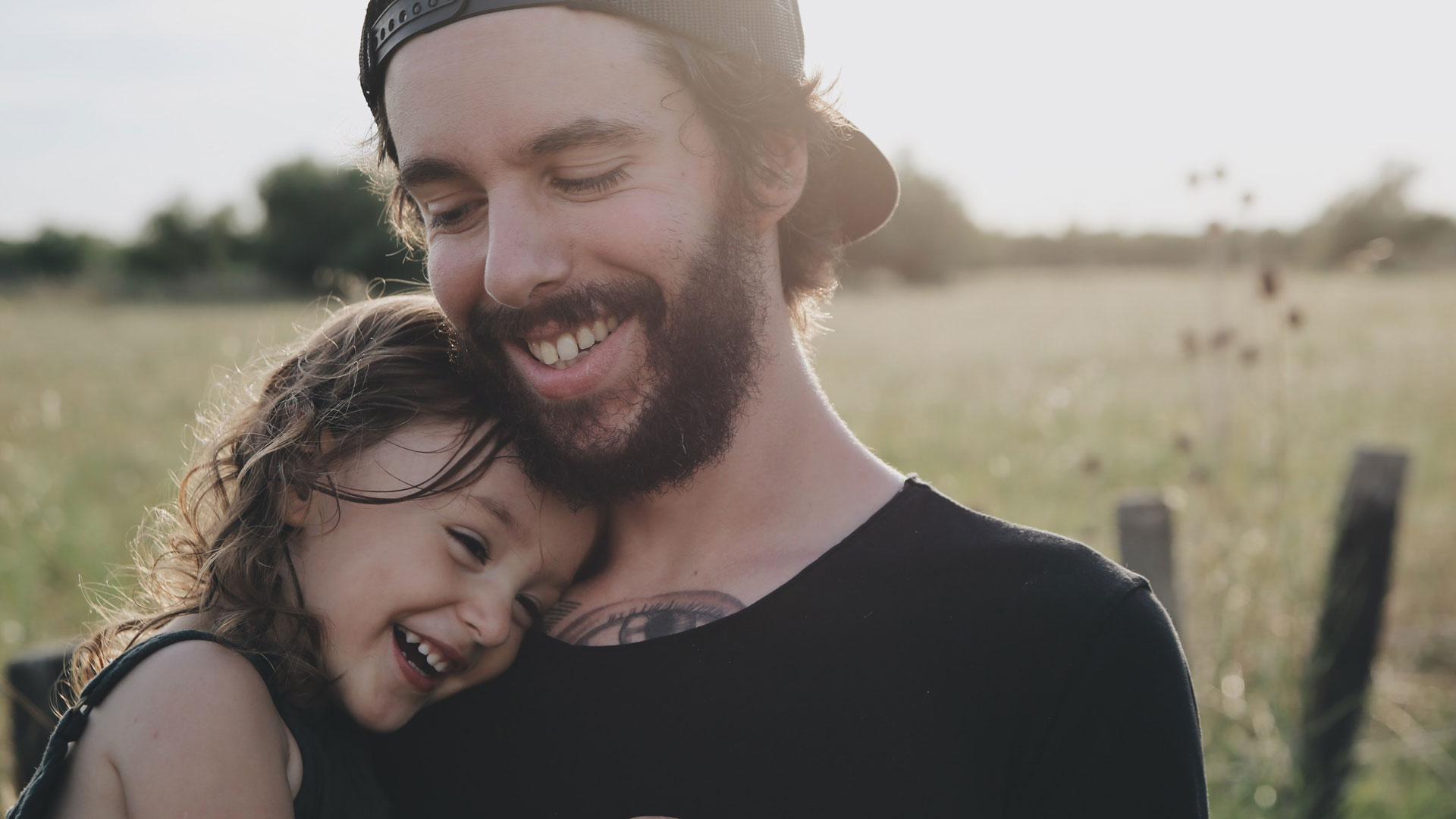 Smiling girl hugs man