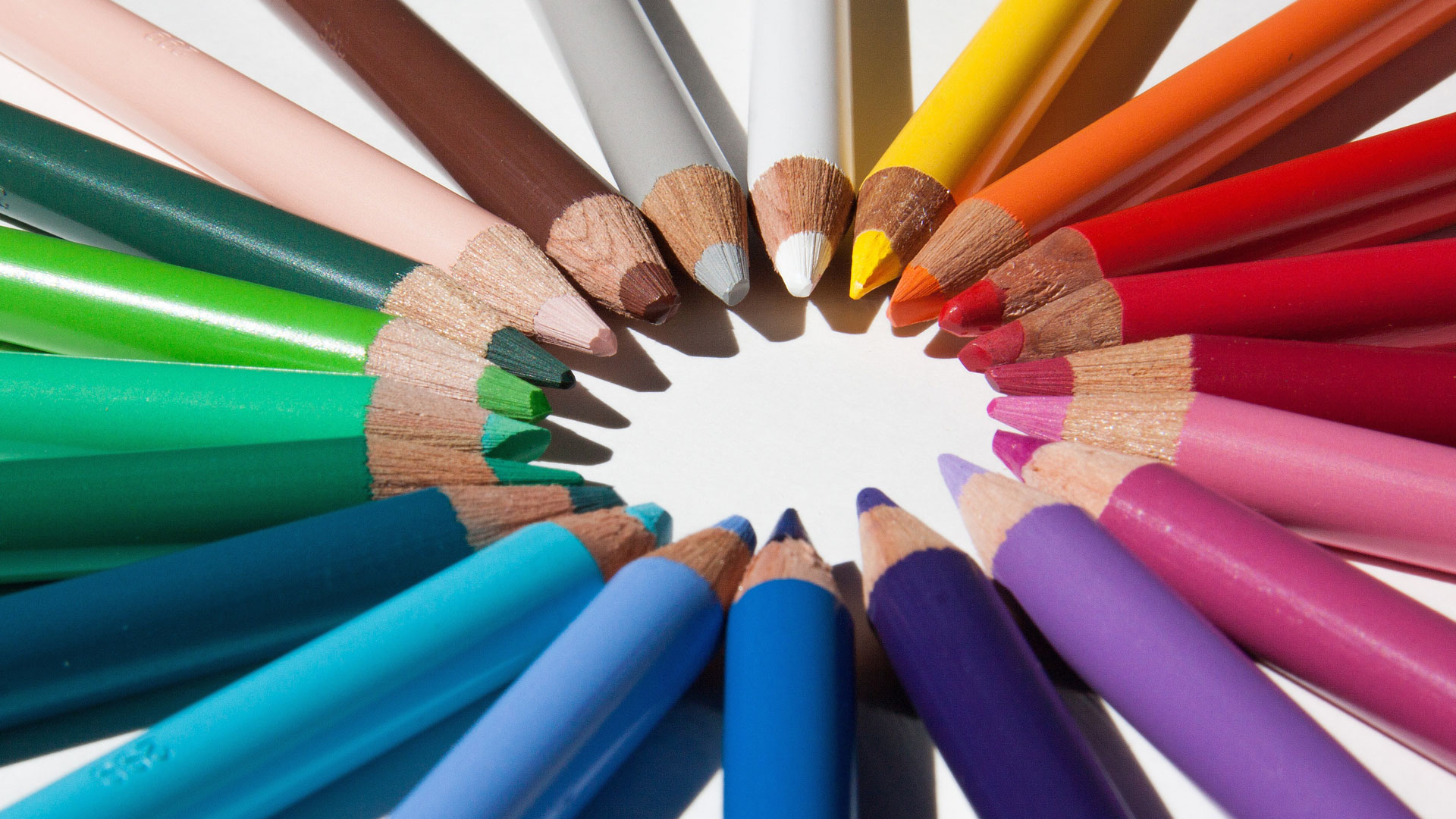 A circle of rainbow pencils.