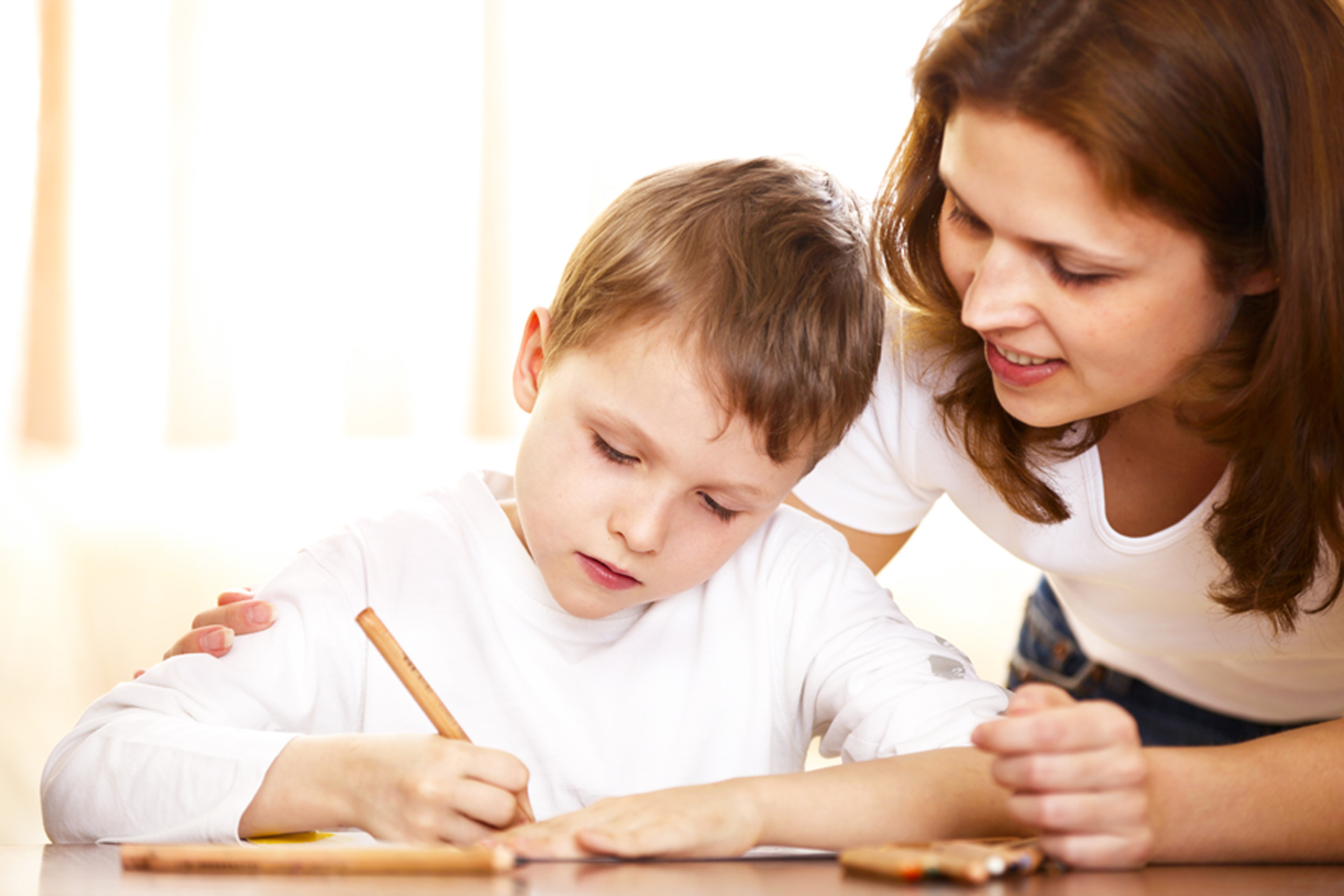 Mum-helping-son-with-homework1440