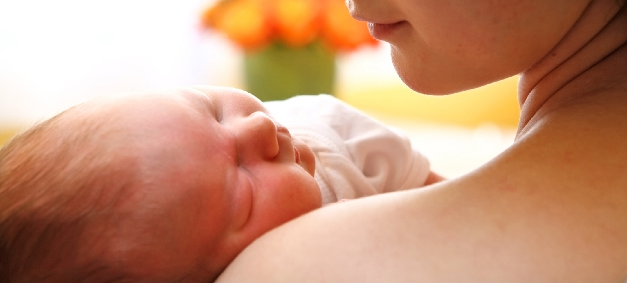mother-cradling-baby-crop