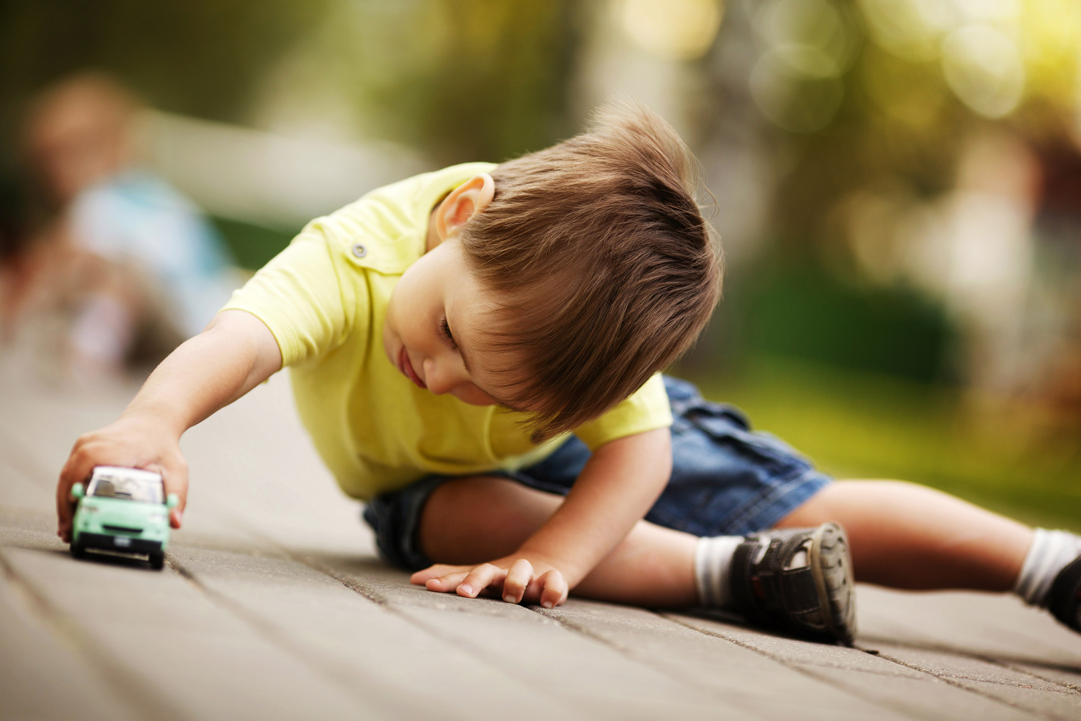 boy-playing-toy-car2160