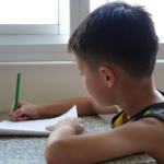 boy-writing-at-table2160