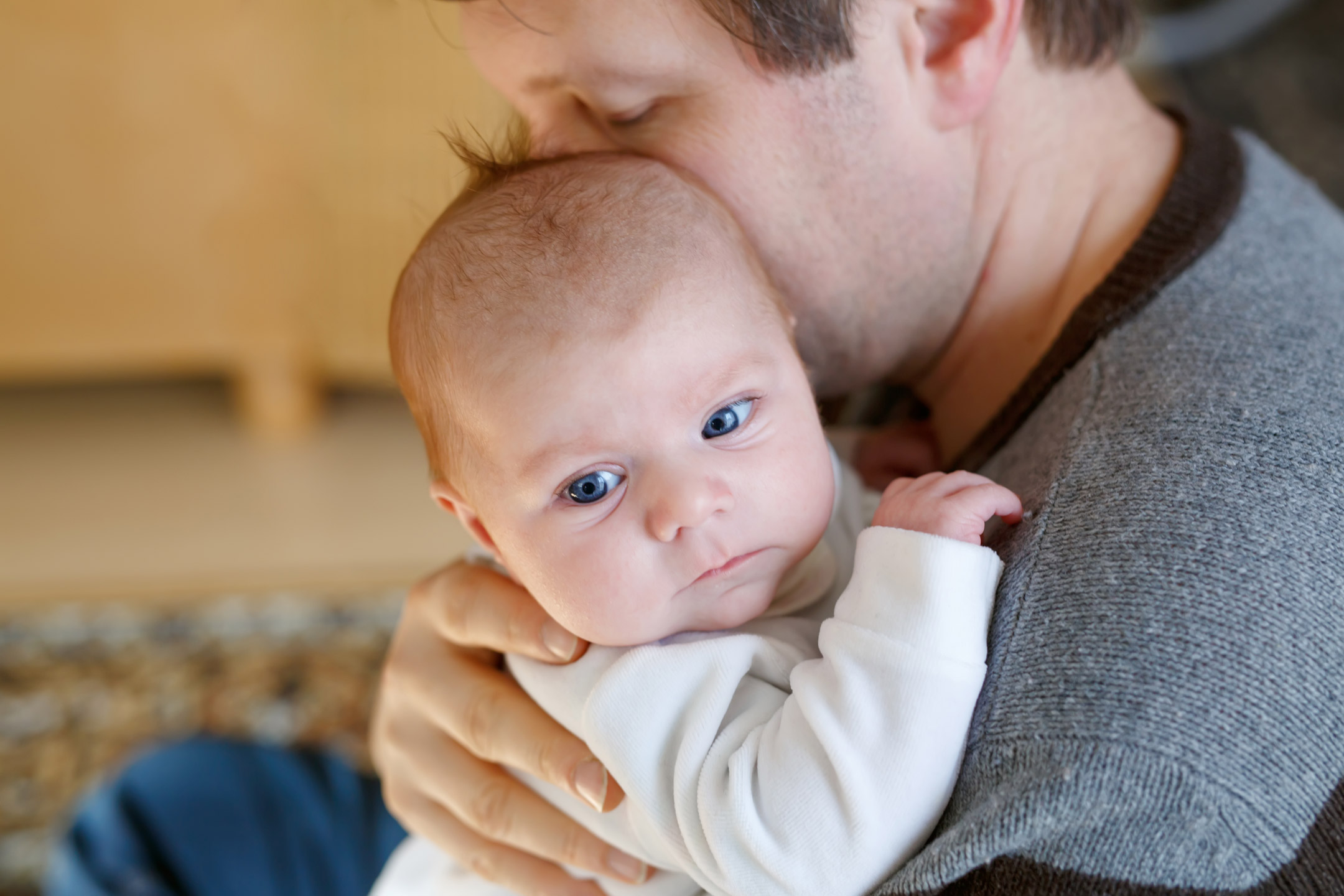 father-cuddling-baby2160