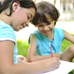 two-children-drawing-in-park2160