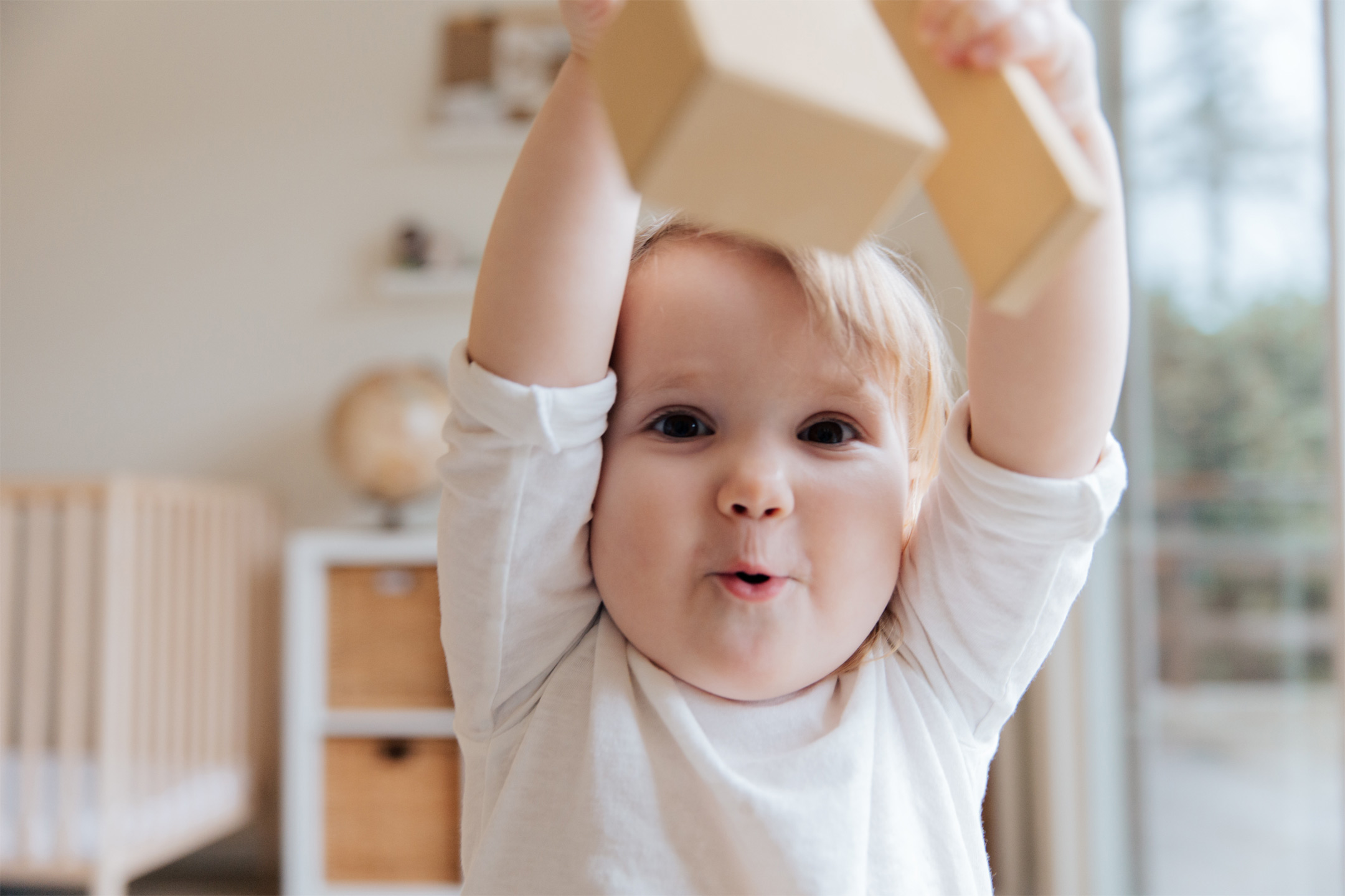 happy-toddler-playing-toy2160