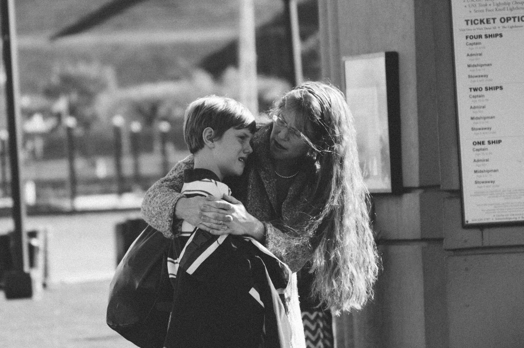 mother-comforting-sad-teen-son-crop