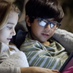 two-kids-looking-at-tablet-at-night2160