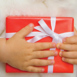 red-gift-clutched-by-child2160