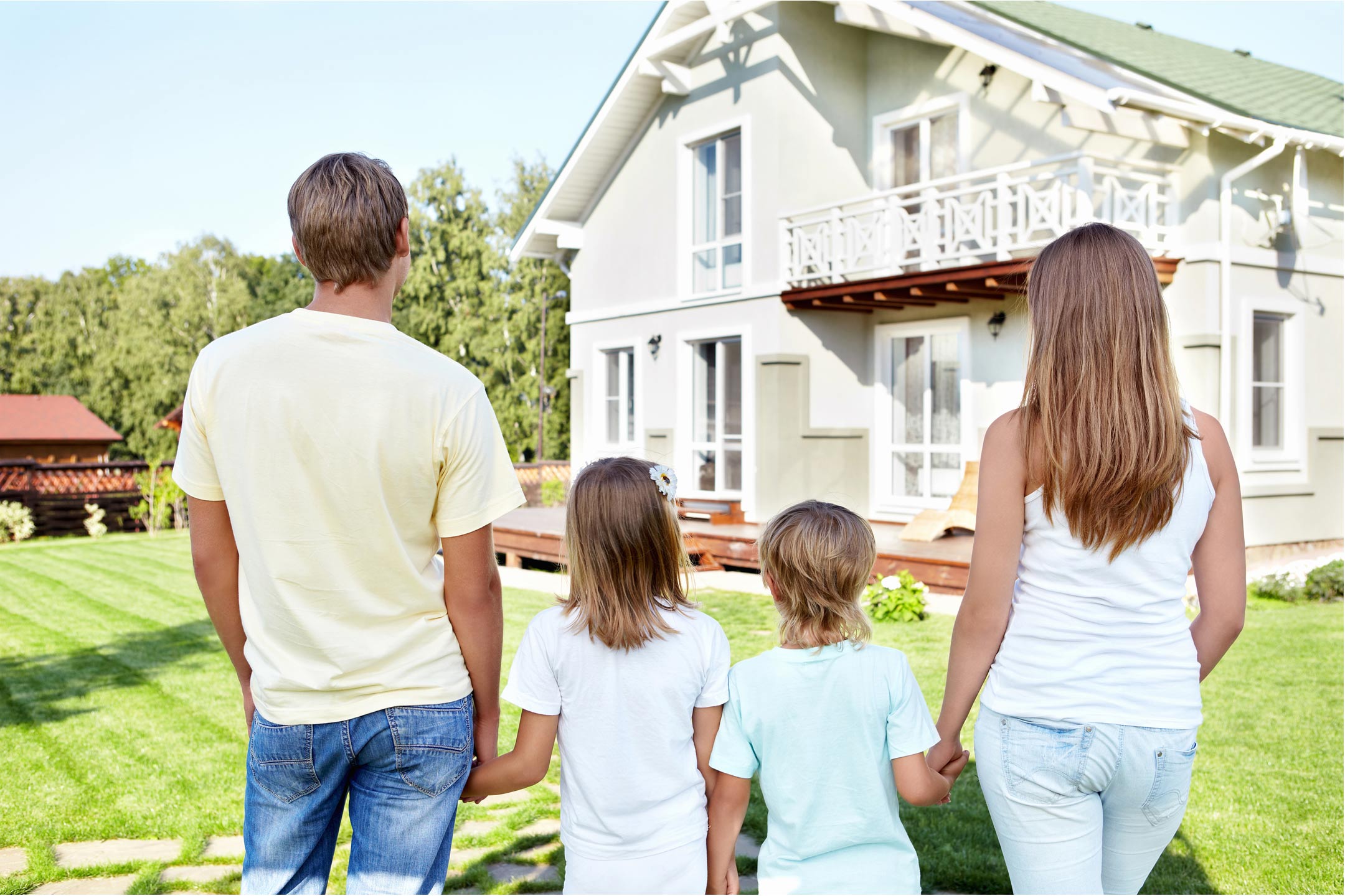 family-looking-at-house2160