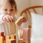 little-girl-playing-wooden-blocks2160
