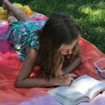 tween-girl-reading-on-grass2160