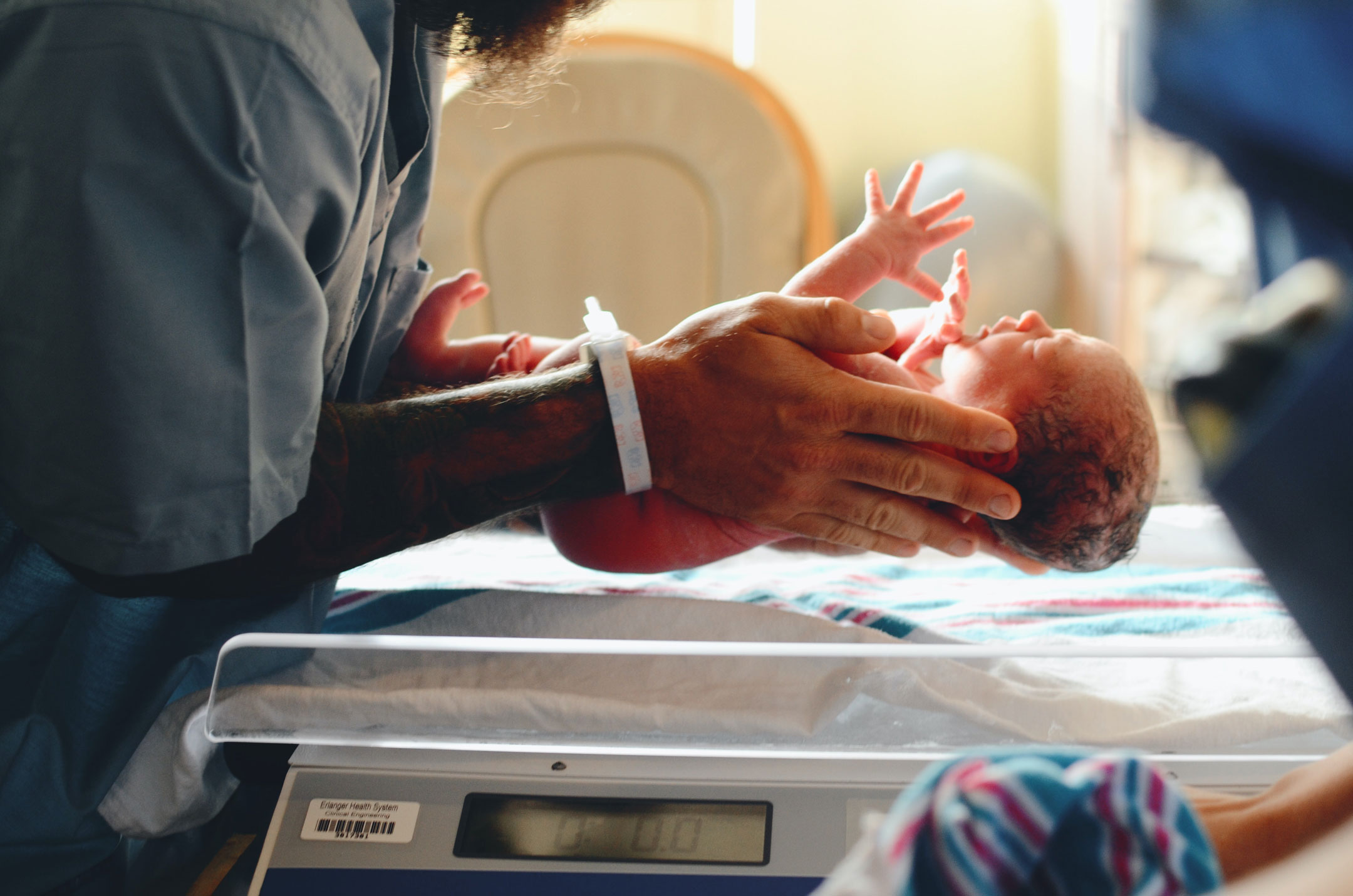 newborn-held-in-delivery-room