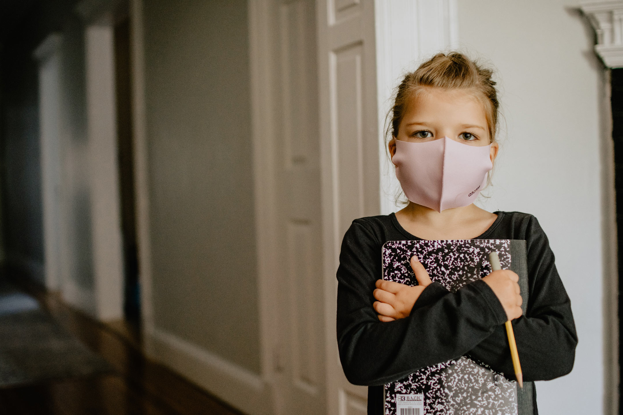 girl-masked-holding-sketch-book