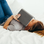 teen-reading-a-book-in-bed-sad2160