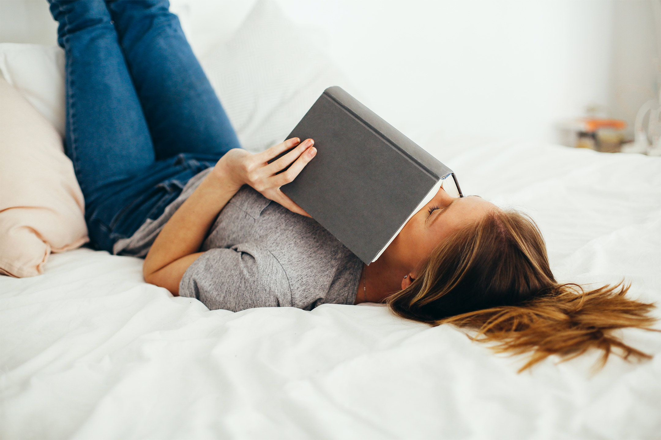teen-reading-a-book-in-bed-sad2160