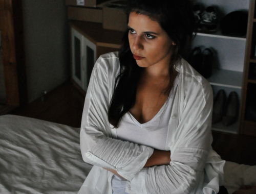 woman-on-bed-upset2160