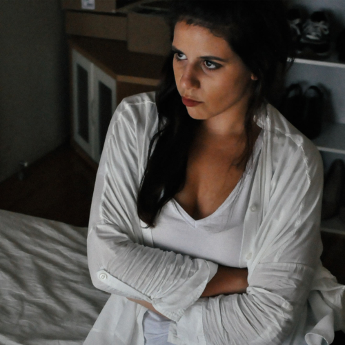 woman-on-bed-upset2160